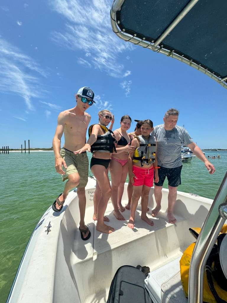 Group of guests on Salty Dogs boat at Shell Island